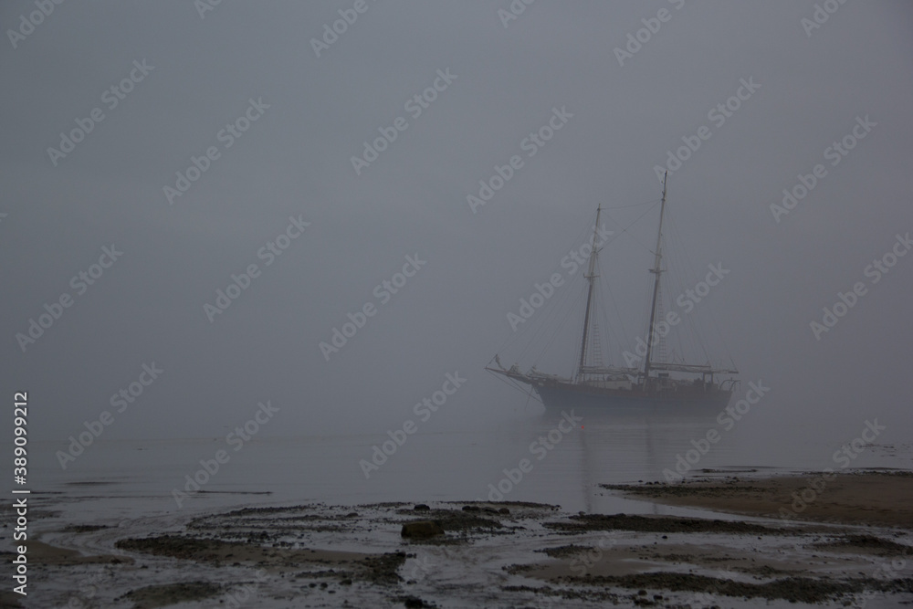 ghost boat on the sea, boat in fog