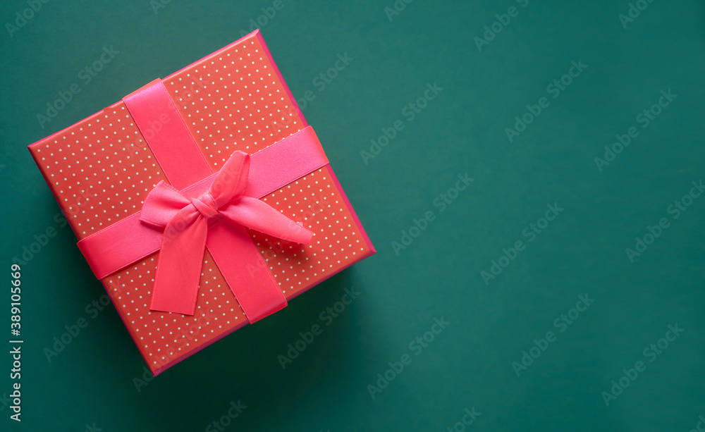 Christmas background with copy space over green desk. Card with red gift for your design Christmas background with copy space over green desk. Card with red gift for your design
