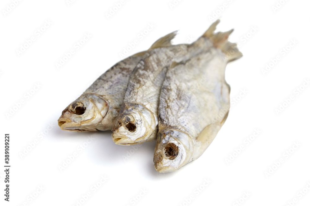 Three dry fish isolated on white background. Three dry fish isolated on white background.