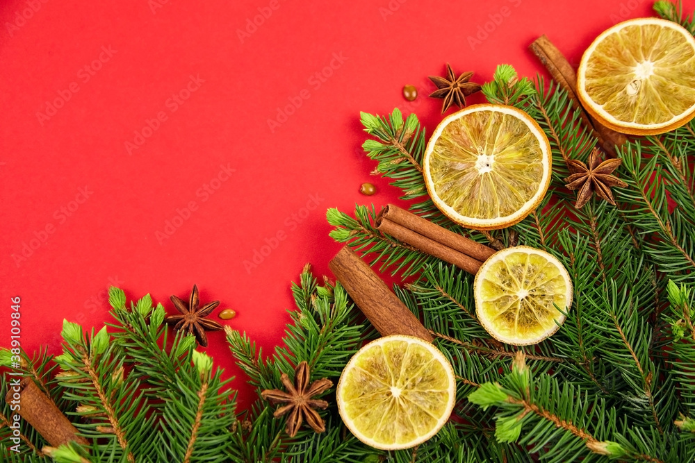 Christmas tree branches, dry orange slices, cinnamon and anise spices Christmas tree branches, dry orange slices, cinnamon and anise spices