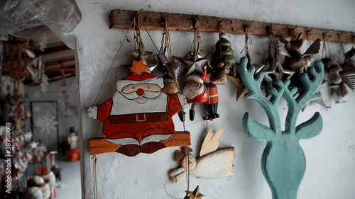 Christmas wooden toys of santa claus hanging in the house