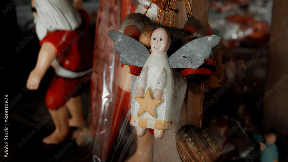 Christmas wooden colourise toys of angel hanging in the house