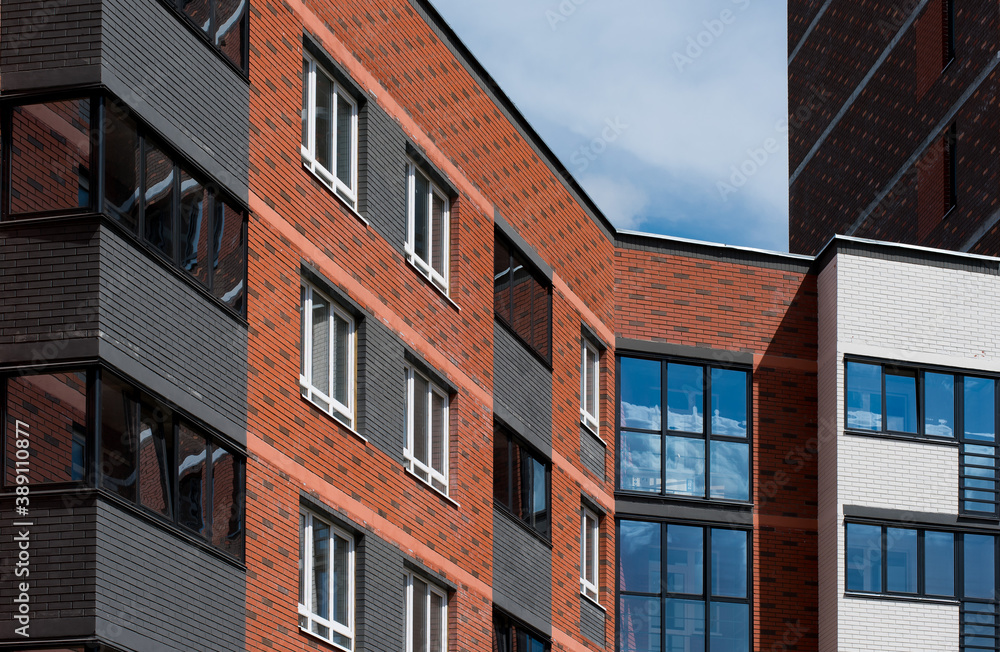 part of the brick facade of a modern new house