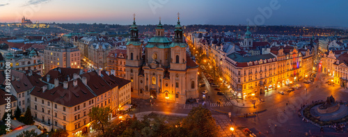 PRAGUE, CZECH REPUBLIC - OCTOBER 17, 2018: The panorama with the St. Nicholas church,   Staromestske square and the Old Town at dusk.