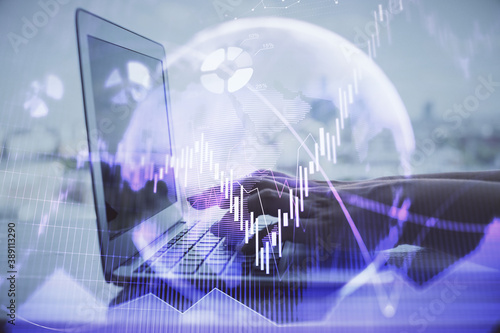 Double exposure of woman hands typing on computer and forex chart hologram drawing. Stock market invest concept.