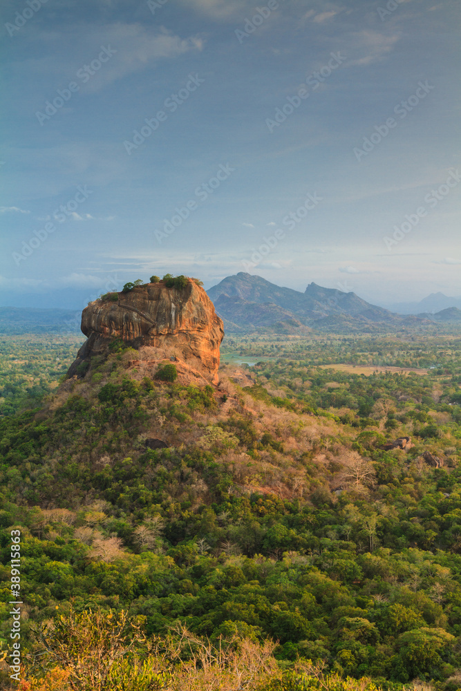 Naklejka premium Sigiriya lion rock ancient rock fortress, archaeological site and tourist destination in Sri Lanka view from Pidurangala.
