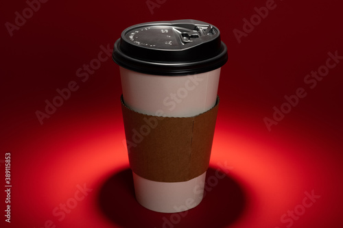 paper coffee cup with a spot light