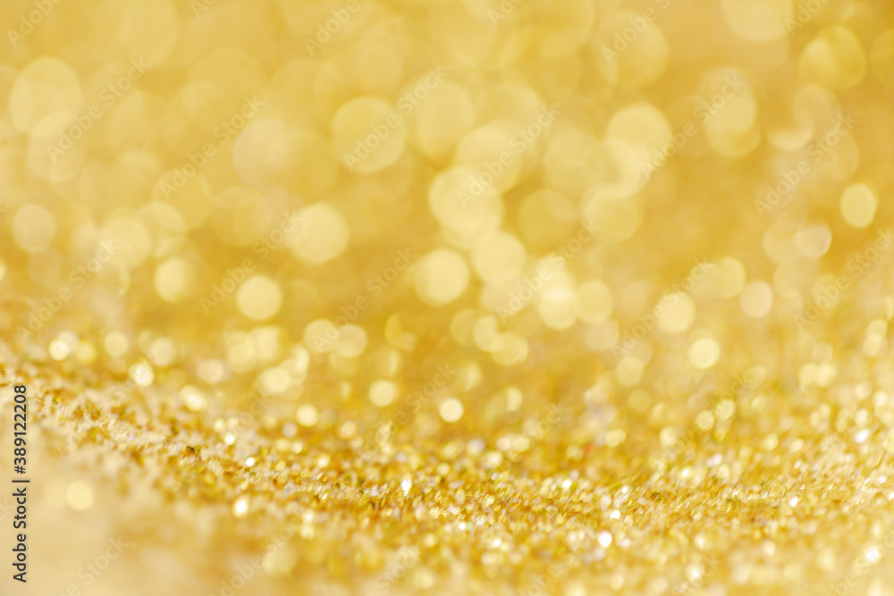 Gold light Festive Christmas background. Abstract twinkled bright background with bokeh defocused golden lights Gold light Festive Christmas background. Abstract twinkled bright background with bokeh defocused golden lights