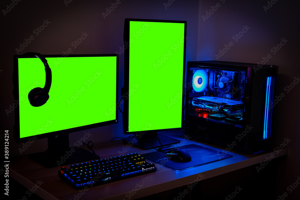 High-end PC Game Rig with dual Mock Up Green Screen or chroma key Monitor  Stands. Modern Design is Lit with Blue and Neon Light. Photos | Adobe Stock