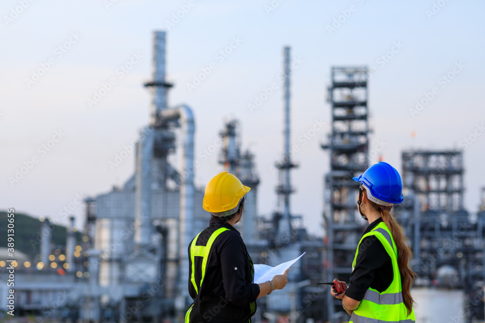 custom made wallpaper toronto digitalSmart two female engineer discussion together at refinery industry plant at industry factory center area. Engineering Concept