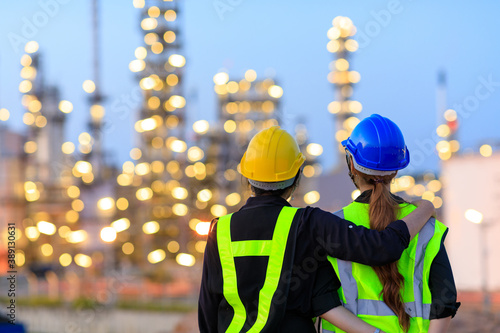 Smart two female engineer discussion together at refinery industry plant at industry factory center area. Engineering Concept