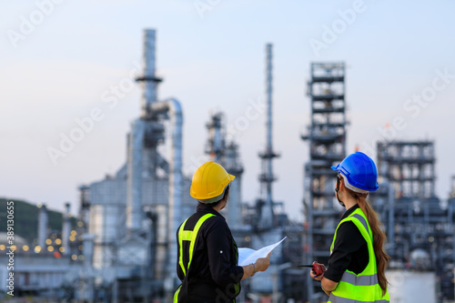 Smart two female engineer discussion together at refinery industry plant at industry factory center area. Engineering Concept
