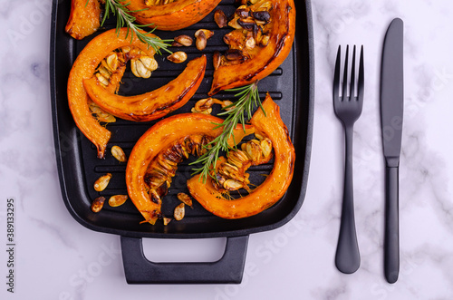 Baked pumpkin slices with seeds