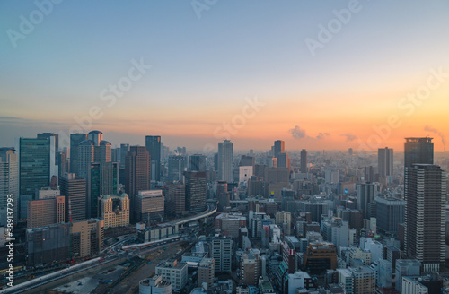 city at sunset,Landscape of Osaka city with sunset sky at Japan
