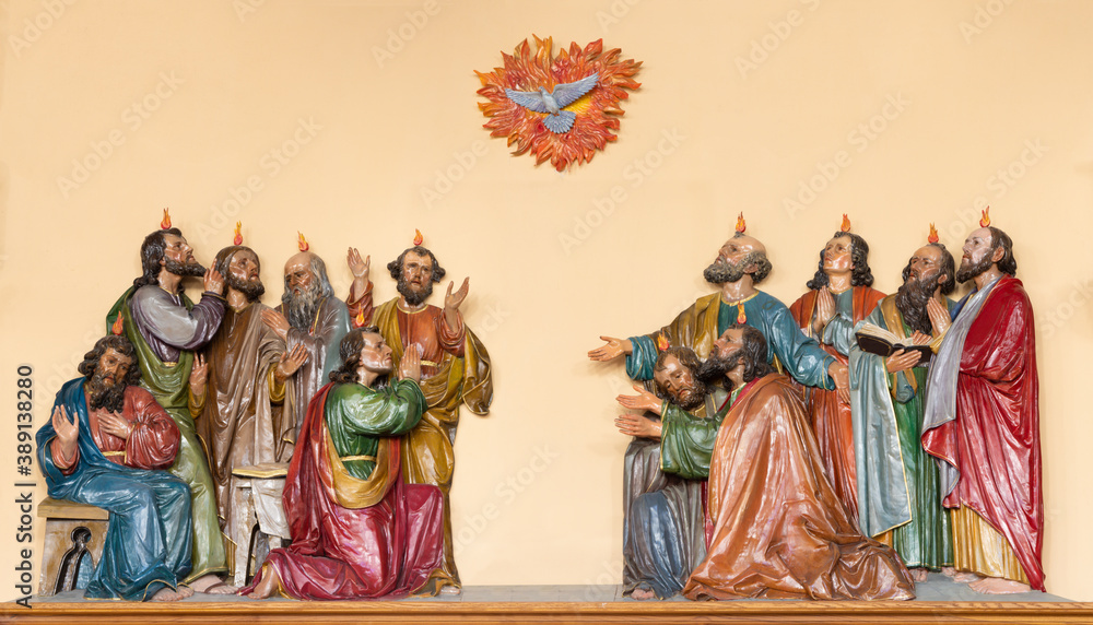 VIENNA, AUSTIRA - OCTOBER 22, 2020: The calved polychrome sculptural group of Pentecost in church Pfarrkirche Kaisermühlen.
