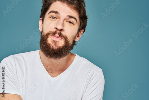 emotional man gesturing with hands lifestyle fun white t-shirt blue isolated stock © SHOTPRIME STUDIO