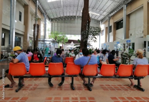 Many patients with heat fever are arranged to sit and wait to see a doctor and hospital services outside the building to prevent the request of the virus. Covid 19 ... Lens blurred. ... Lens blur.