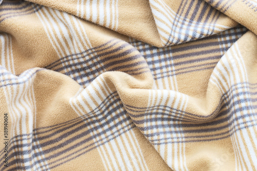 A soft blanket with a checkered pattern.