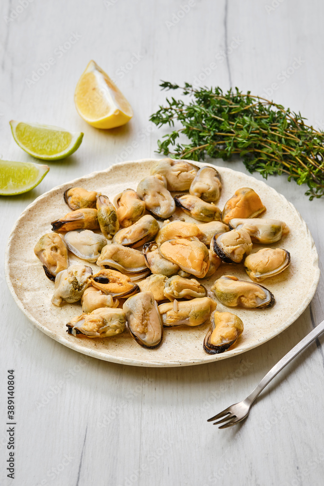 Peeled mussels on ceramic plate Peeled mussels on ceramic plate