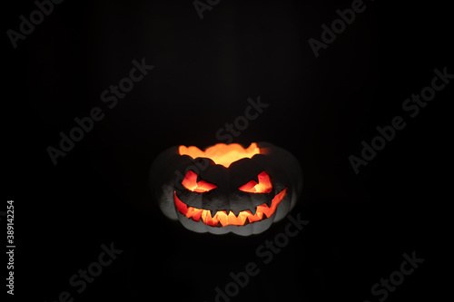 A terrible pumpkin with burning eyes, a cloud of smoke enveloped it. Halloween is coming soon