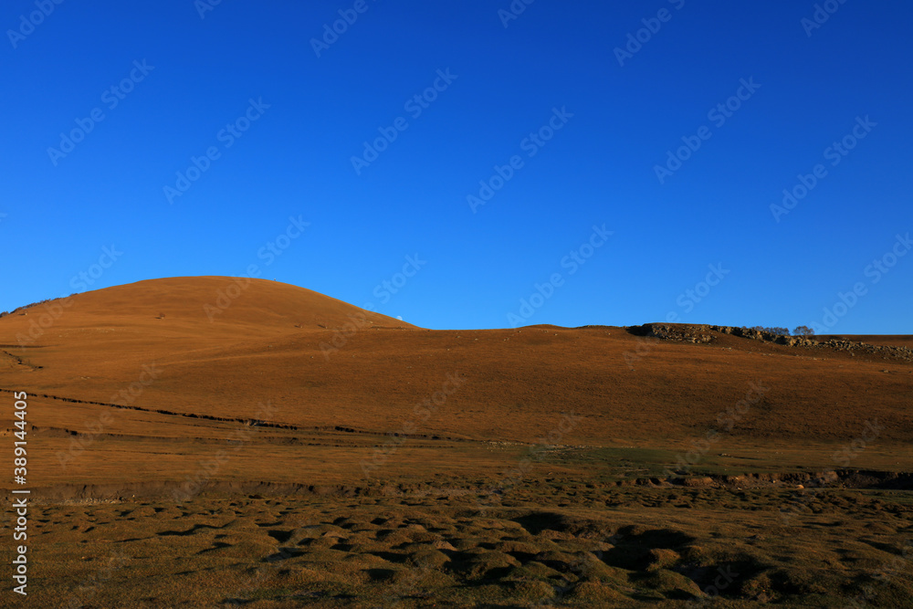 Fototapeta premium Hills under blue sky in Keshiketeng World Geopark, Inner Mongolia