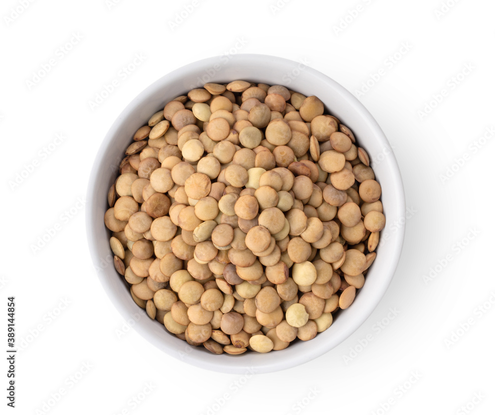 Uncooked lentils in white bowl isolated on white background Uncooked lentils in white bowl isolated on white background