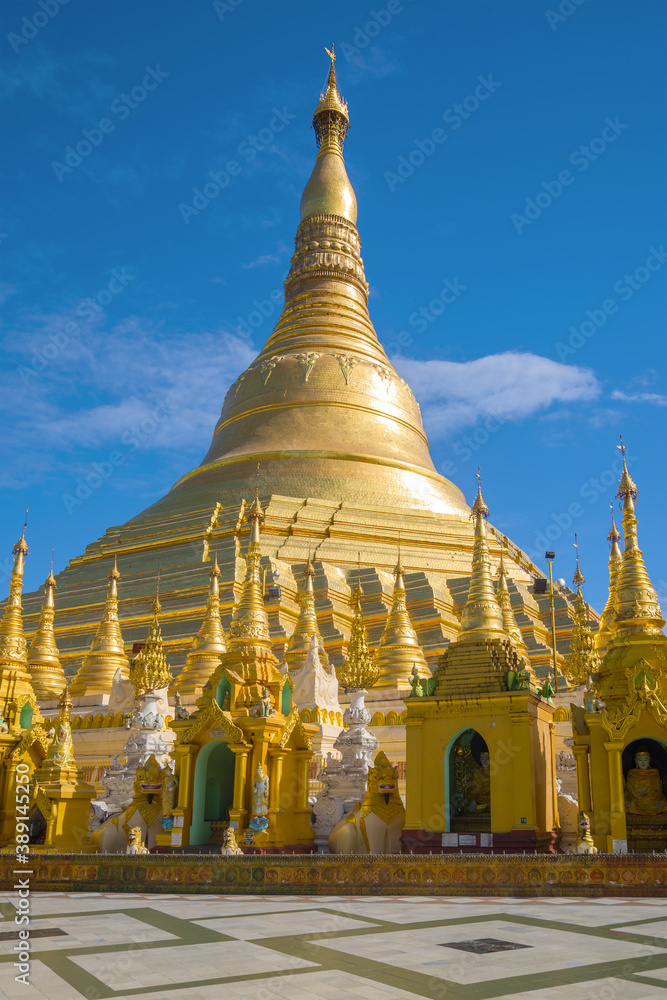 Fototapeta premium Sacred Shwedagon stupa against the blue sky. Yangon, Myanmar