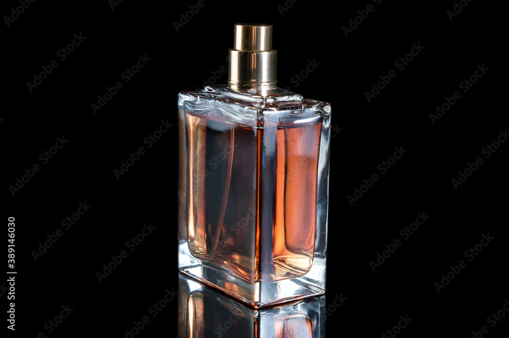 Bottle with perfume on black background. Bottle with perfume on black background.