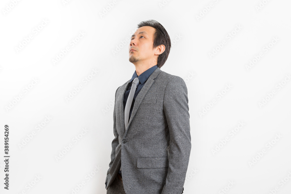 Successful Asian business man in suit and tie with confidence gesture on white background. Successful Asian business man in suit and tie with confidence gesture on white background.