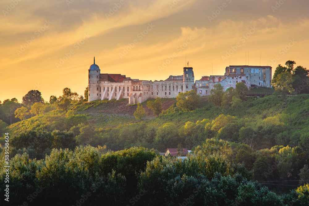 Castle on the hill at sunset. Castle in Janowiec in the Lublin region in the rays of the setting sun.