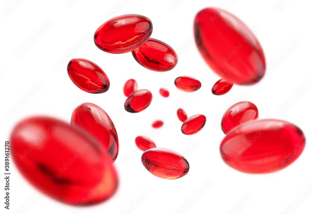 Red capsules levitate on a white background Red capsules levitate on a white background