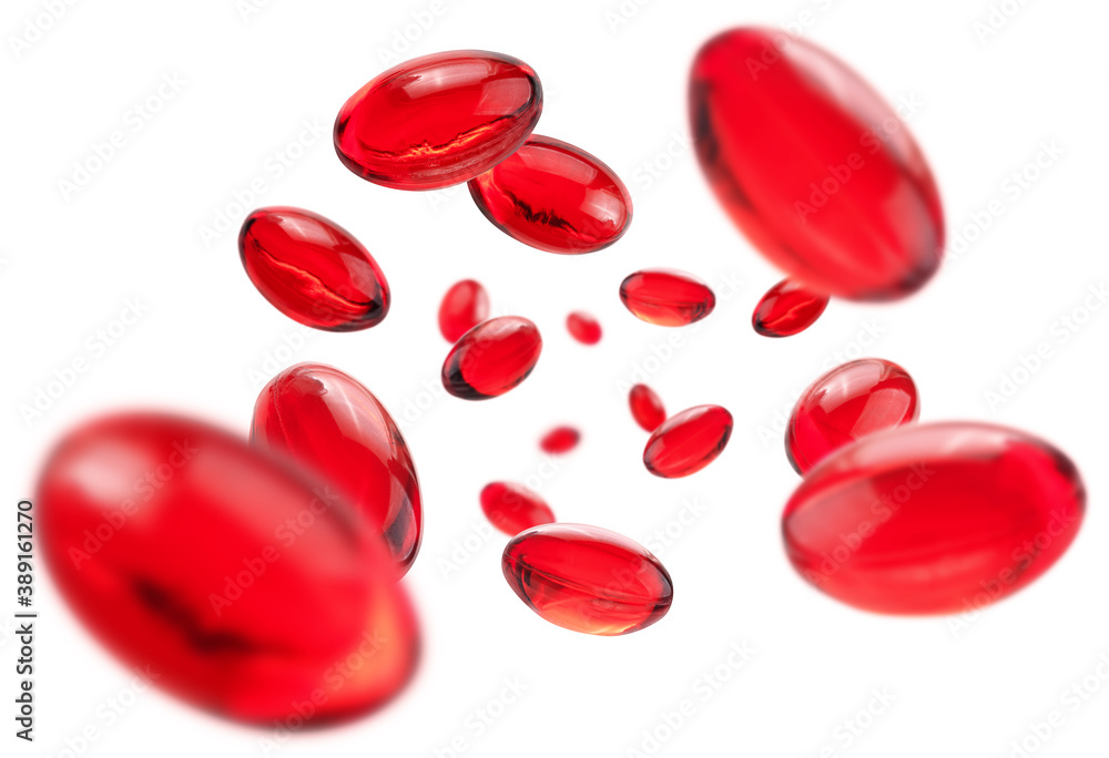 Red capsules levitate on a white background