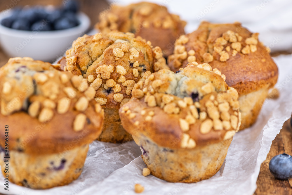Some Blueberry Muffins (close-up shot; selective focus)