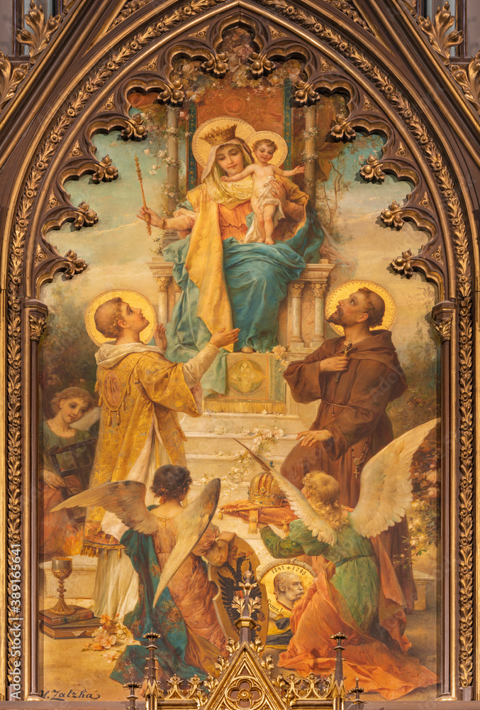 VIENNA, AUSTIRA - OCTOBER 22, 2020:  The painting of Madonna wiht the S. Laurence and St. Francis of Assisi in  church Laurentiuskirche by Hans Zacka from end of 19. cent..