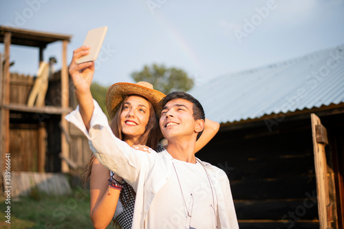 Two Friends Smiling and Taking selfie in the Ranch