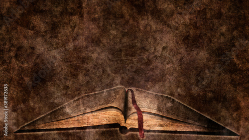 Vintage old book on abstract dark background © akarb