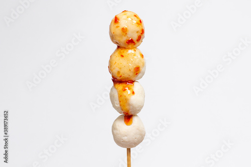 Meat ball stick with spicy sauce isolated on white background
