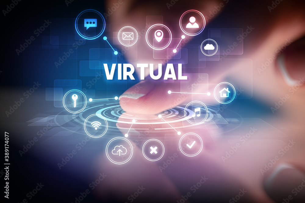 Finger touching tablet with web technology icons and VIRTUAL inscription, web technology concept Finger touching tablet with web technology icons and VIRTUAL inscription, web technology concept