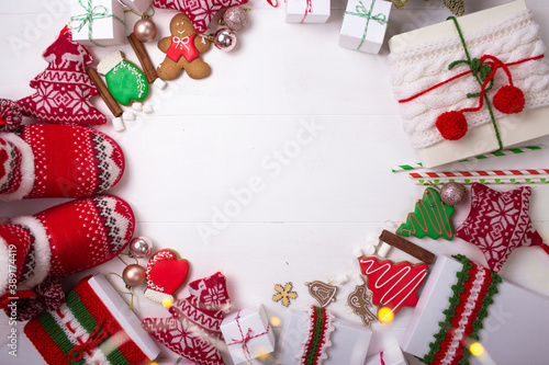 Christmas gifts and beautiful things are arranged in a circle on a white background