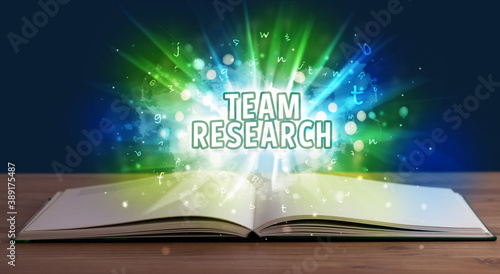 TEAM RESEARCH inscription coming out from an open book, educational concept