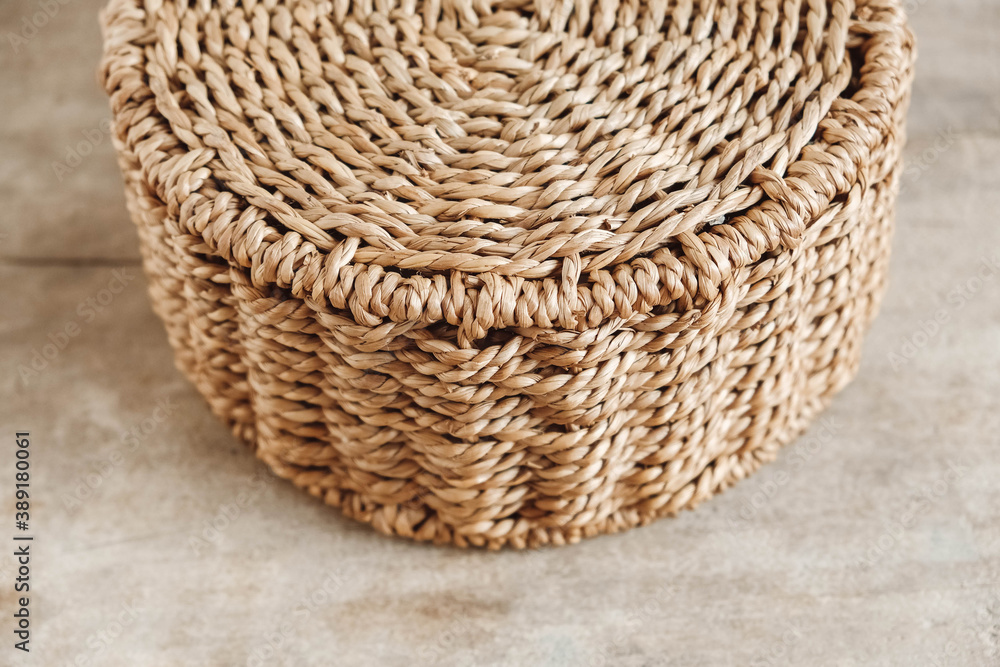 Round wicker basket on a old wooden table. Copy, empty space for text Round wicker basket on a old wooden table. Copy, empty space for text
