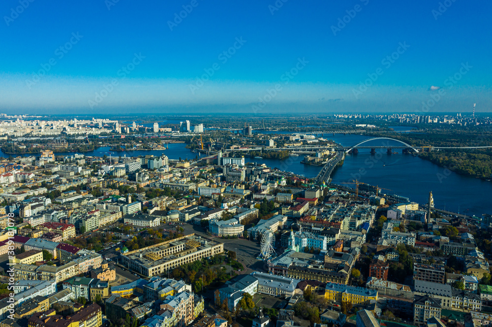 Aerial view of the Dnipro River and districts of Kyiv - the largest city and capital of Ukraine.