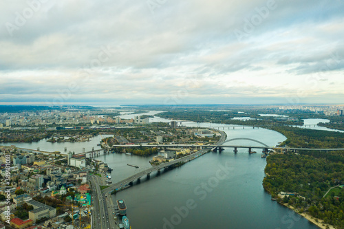 Fototapeta Naklejka Na Ścianę i Meble -  Aerial view of the Dnipro River and districts of Kyiv - the largest city and capital of Ukraine.
