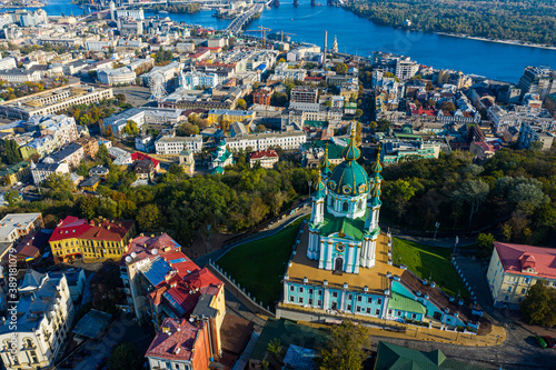 Aerial top view of Saint Andrew's church and Andreevska street from above, Podol district, city of Kyiv, Ukraine