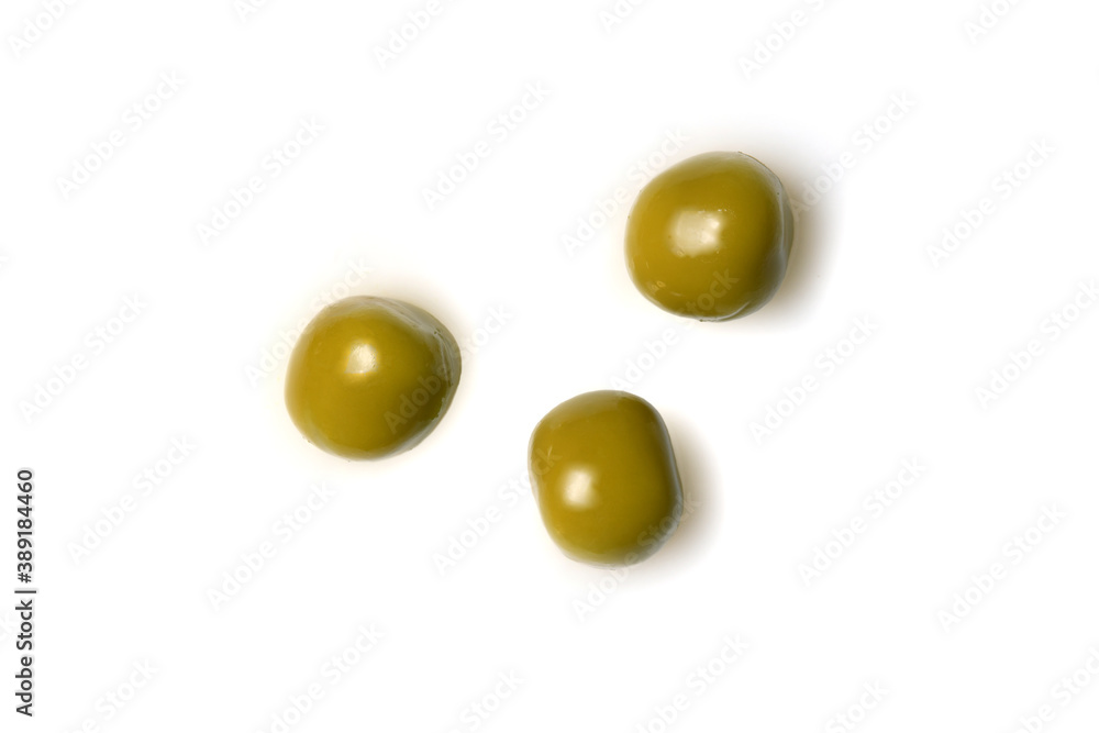 Three canned green peas, macro close up isolated on white backround, top view