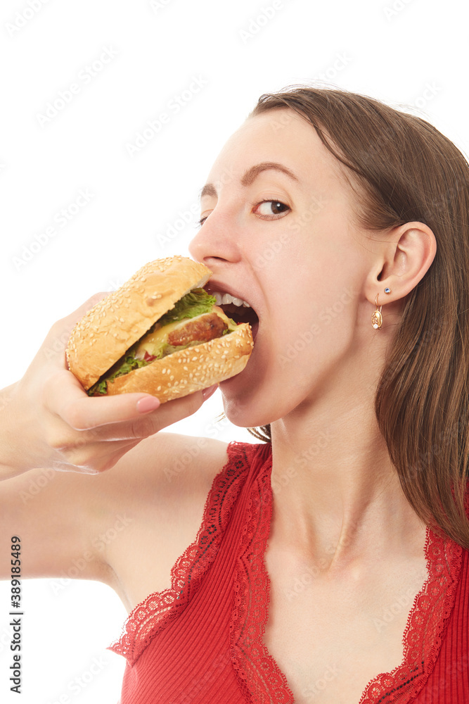 girl eats hamburger