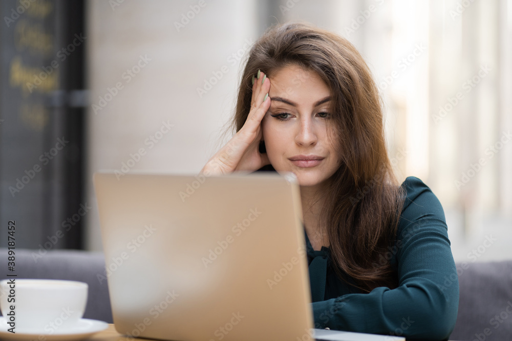 I thought about sending a message to my partner, a friend at a new job. prints a text message on a laptop computer gadget tablet. cute young woman in a summer dress.