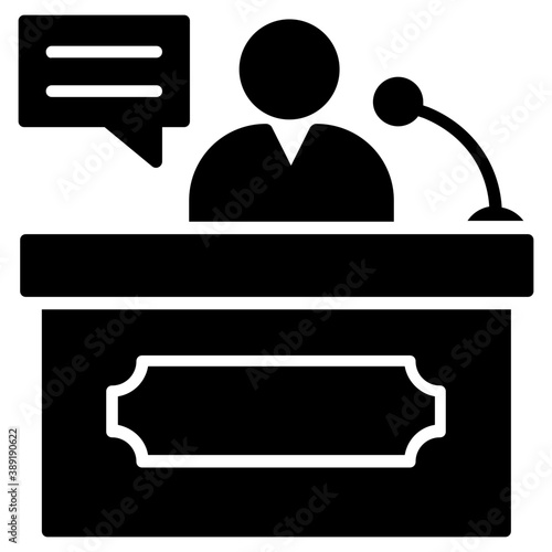 
A person standing on rostrum with microphone representing speech concept
