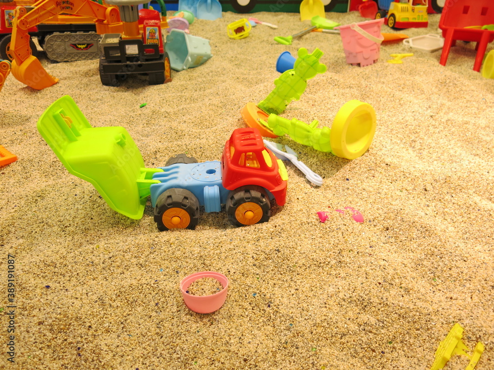 there are many trunks full of sand and all kinds of toys in the Children's bunker for the joyful concept of sandpit there are many trunks full of sand and all kinds of toys in the Children's bunker for the joyful concept of sandpit