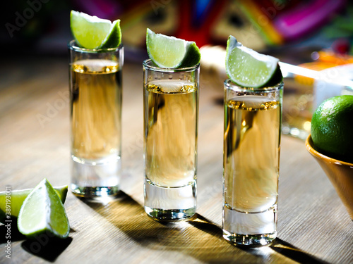 Obraz na plátne Three shots of tequila in tall shot glasses